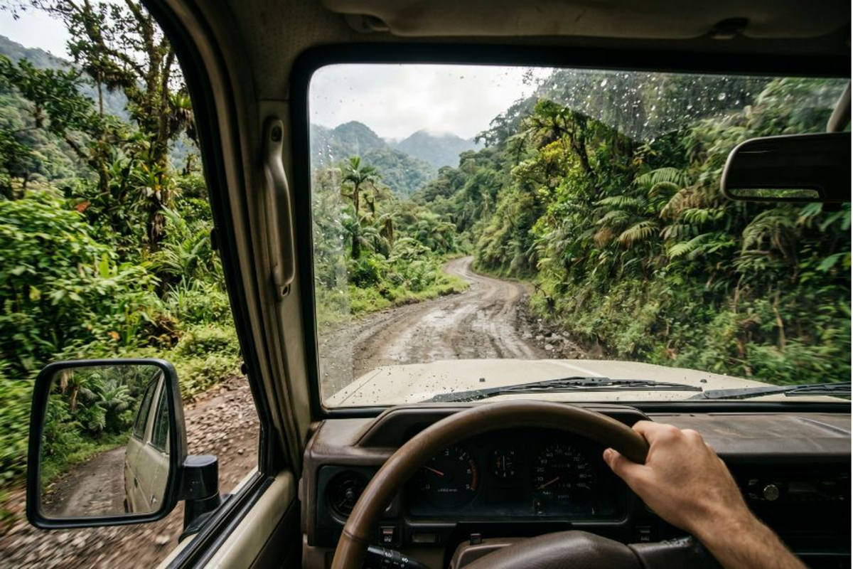 POV from a 4x4 driving through a lush Costa Rican mountain pass Costa Rica.