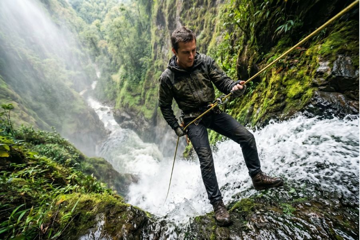 POV looking down a waterfall while rappelling in La Fortuna.