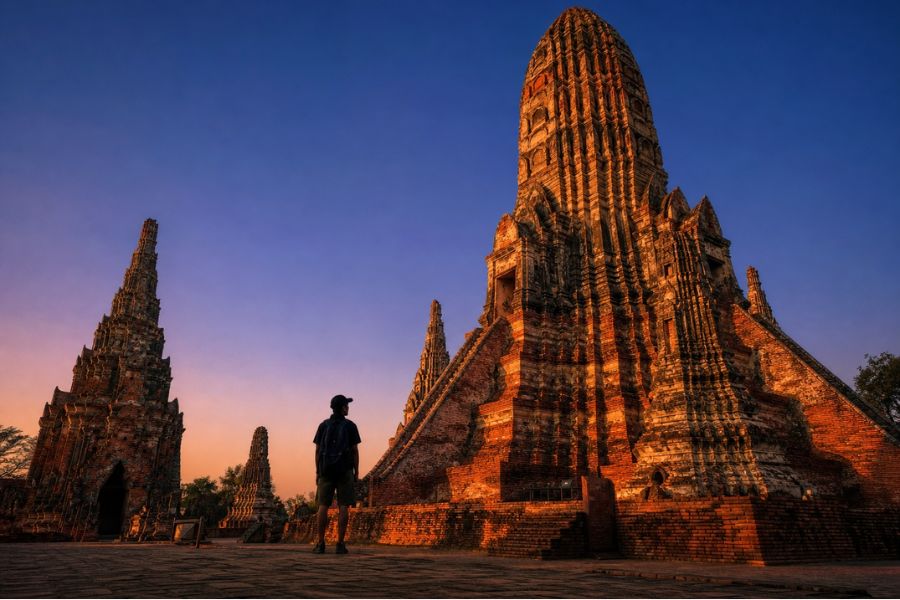 The Khmer-style ruins of Wat Chaiwatthanaram at sunset, a top historical tour in Thailand.