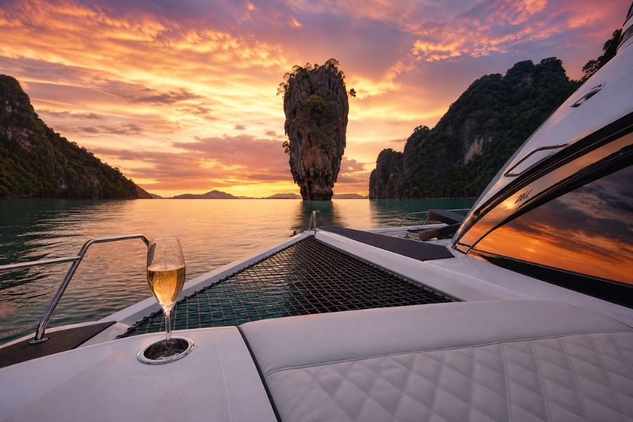 A luxury sailing catamaran anchored near James Bond Island in Thailand, one of the top 15 tours in the country.