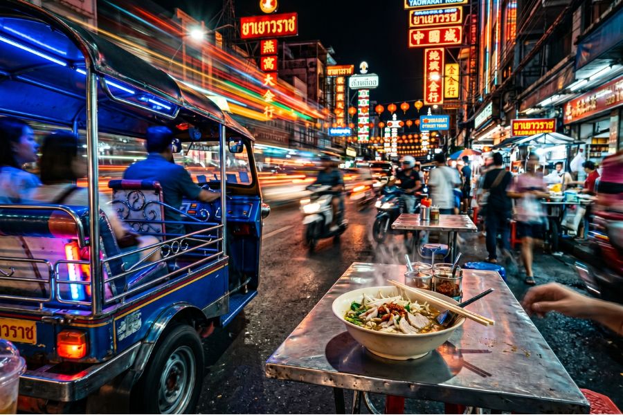 Tasting Pad Thai on a midnight food tour, part of the top 15 best tours in Thailand.